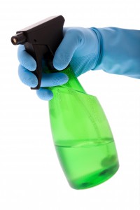 604697-spraying-bottle-with-rubber-glove